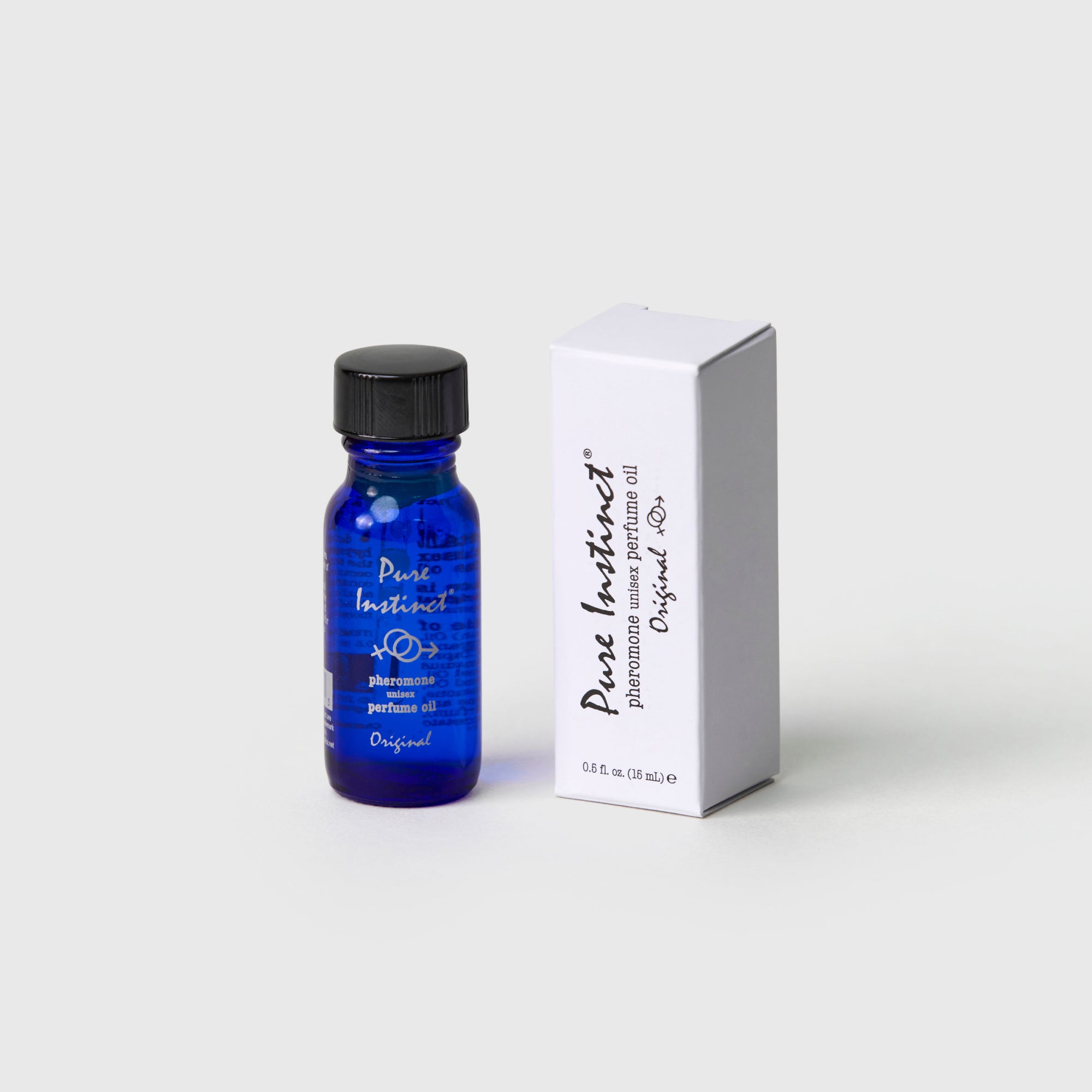 blue glass bottle of Pure Instinct ORIGINAL pheromone infused essential oil displayed on a minimalist pedestal
